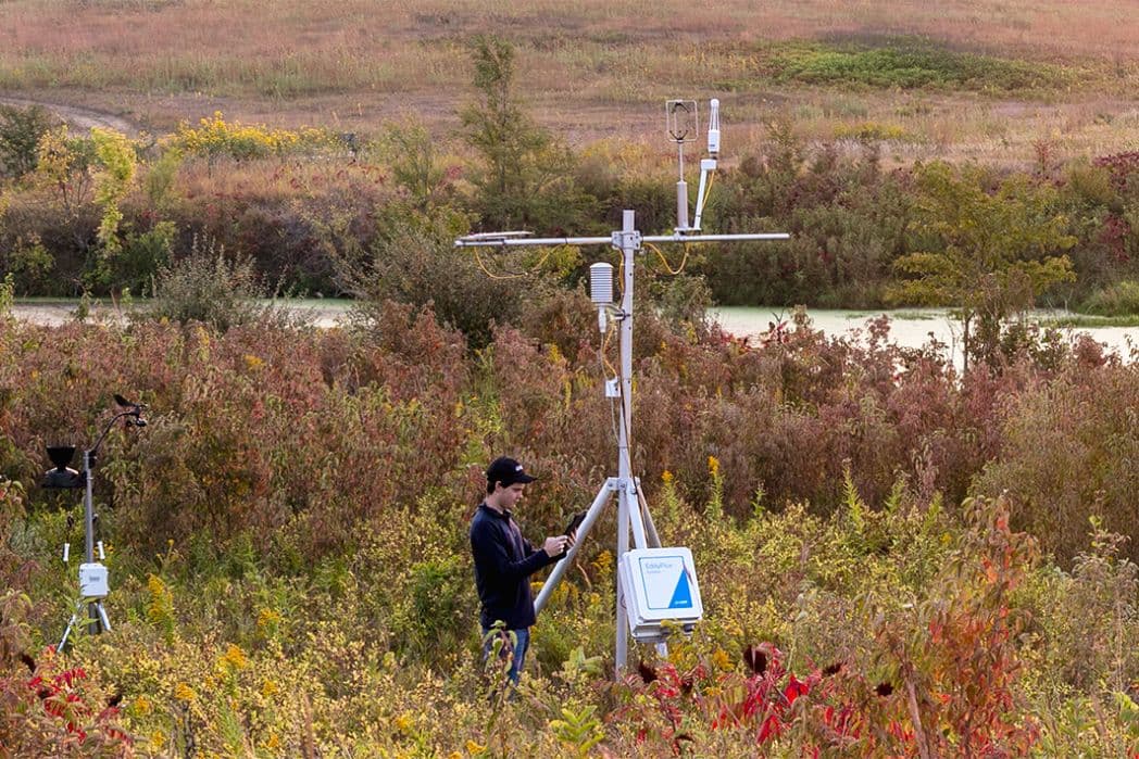 image of a LI-COR representative servicing an EC tower 